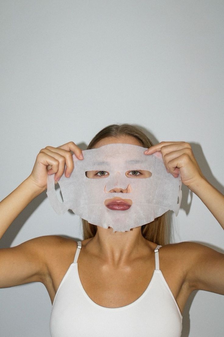 Sheet mask, held up